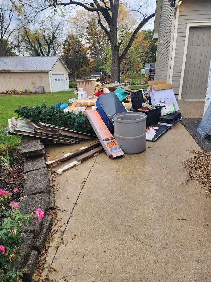 Dumpster being loaded with debris for 3 Yard Dumpster Rental in Vicksburg